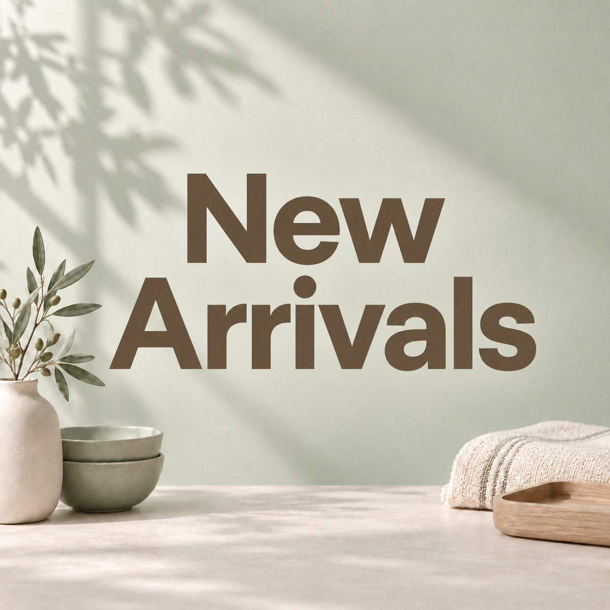 New Arrivals — pastel sage collection cover with large centered lettering